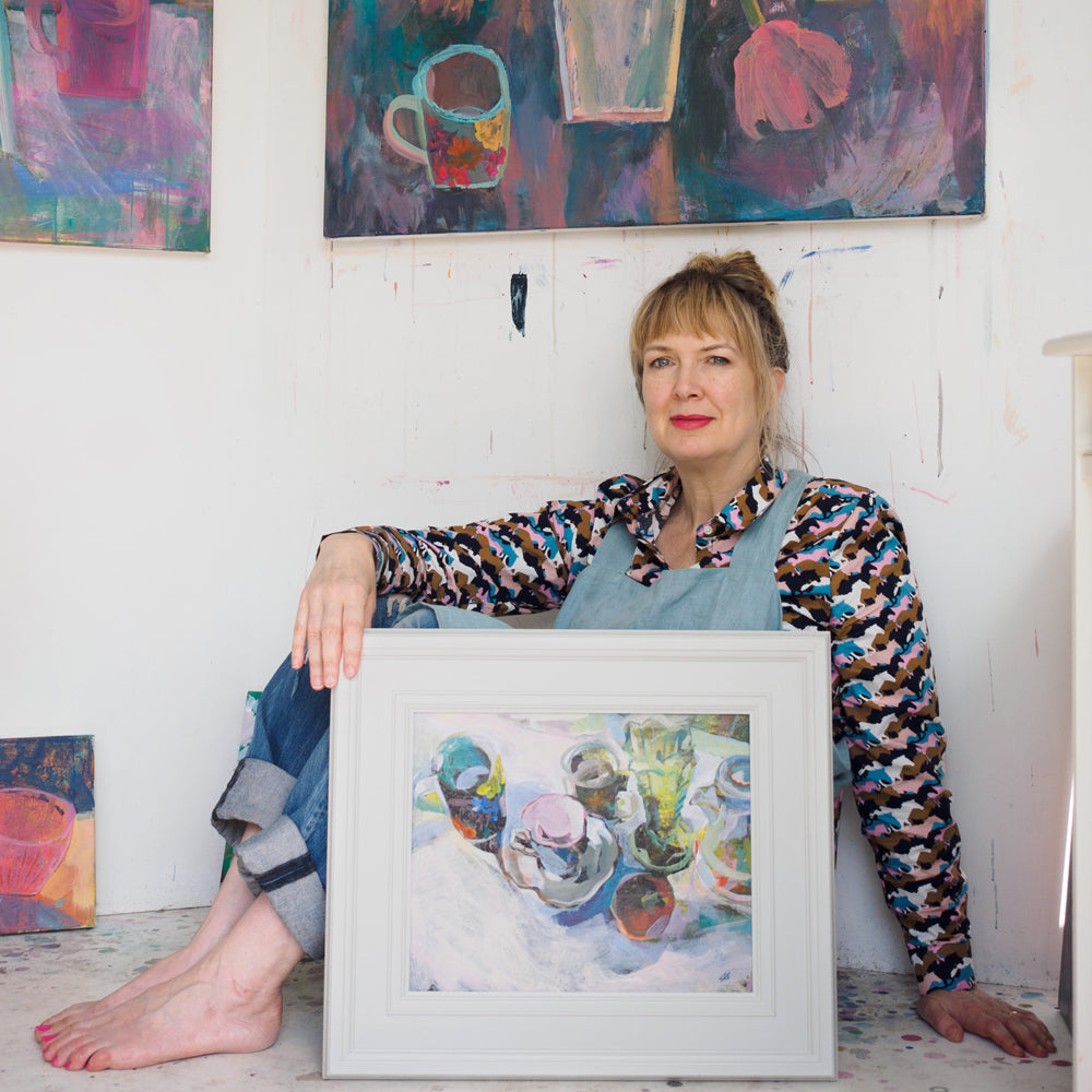 Gabriella Buckingham in her garden studio with a sold Still life painting